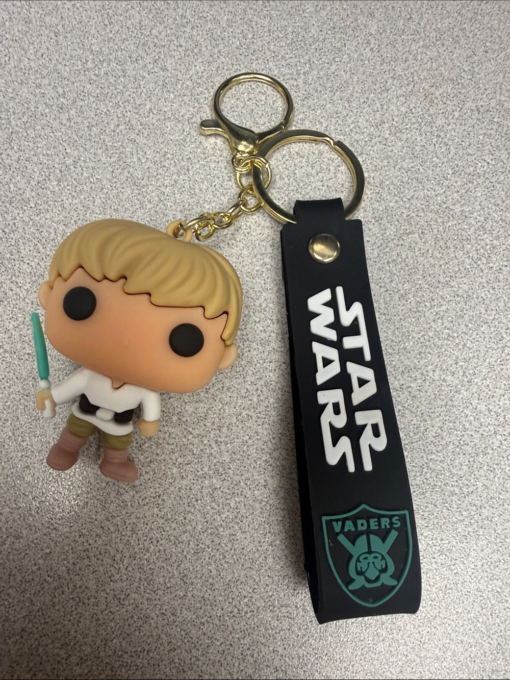 Funko Pop Star Wars Luke Skywalker Keychain with Black Strap and Gold Hardware